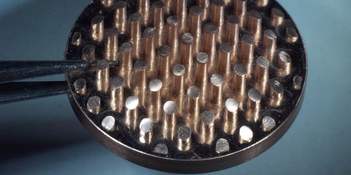micro machining held by tweezers under the microscope